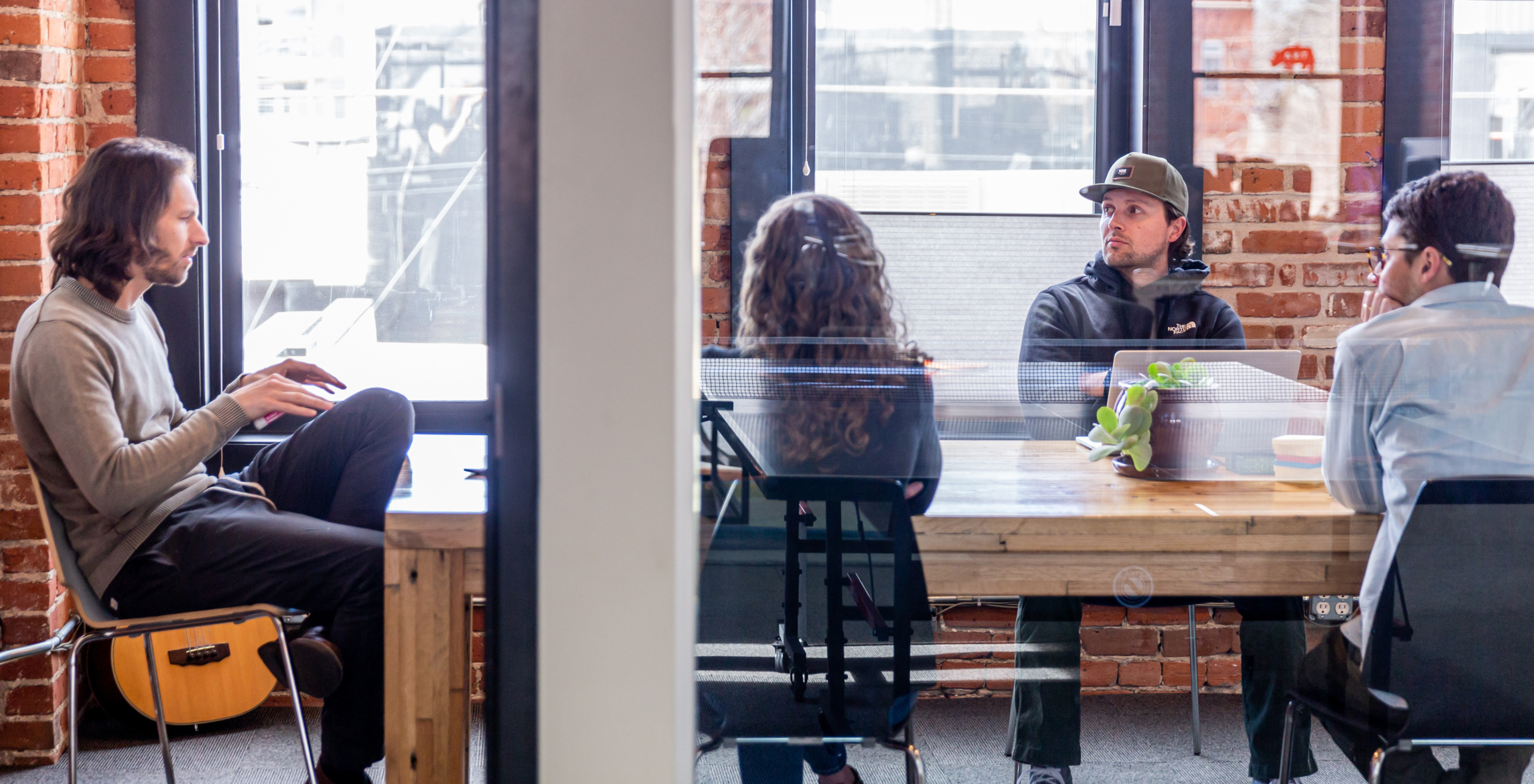 By the Pixel team members collaborate in a meeting room